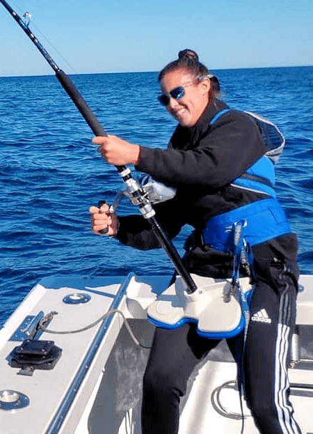 Lady angler that's in for the fight of her life with a big fish.